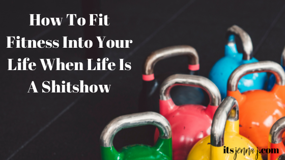 Multi-Colored Kettlebells On A Black Background. "How To Fit Fitness Into Your Life When Life Is A Shitshow" in white print
