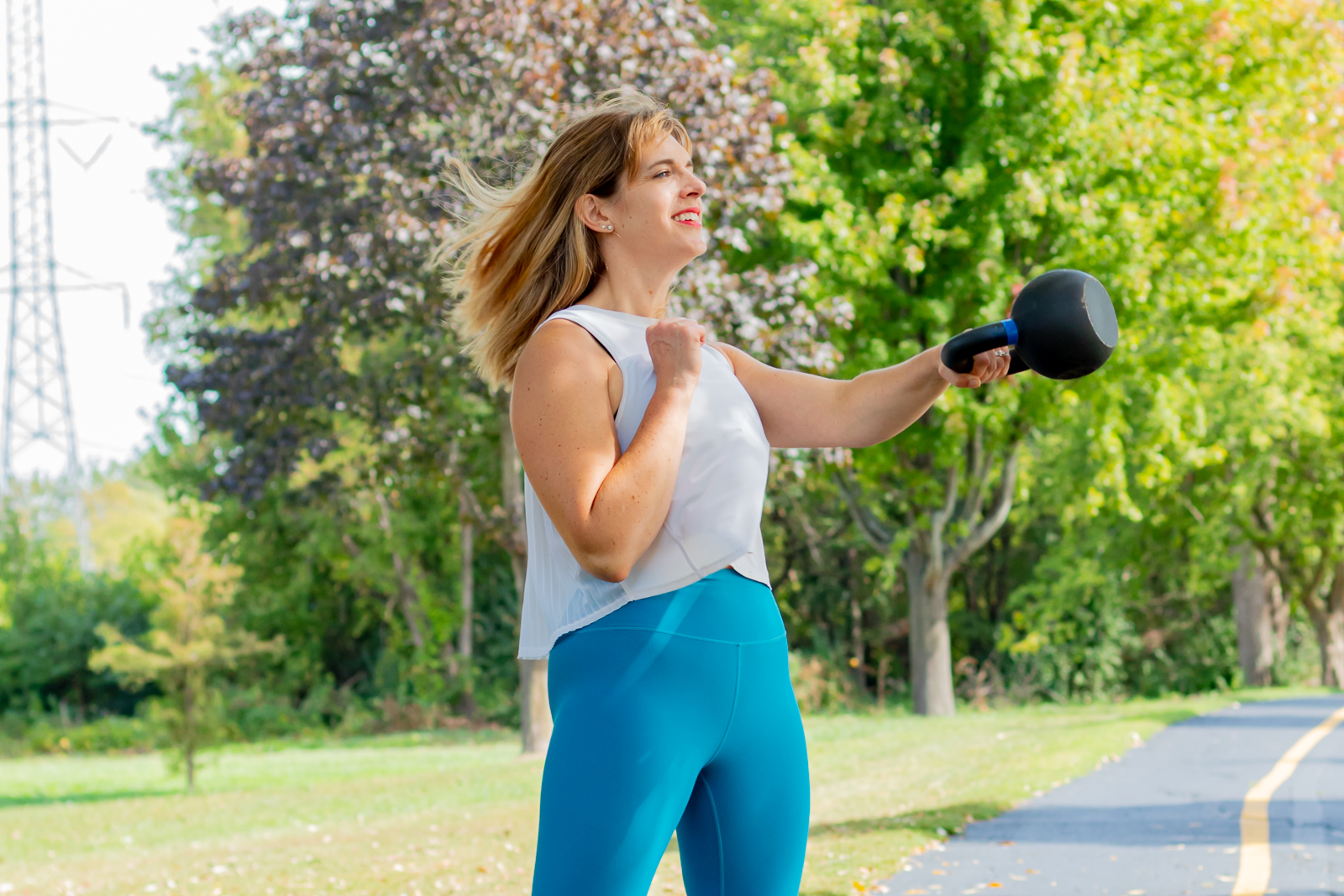 Jenna is doing a single arm kettlebell swing