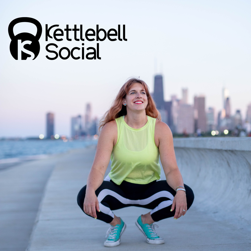 Jenna is squatting down by the lakefront with the Chicago skyline in the background at sunset. She's wearing black and white leggings, turquoise Converse and a highlighter yellow tank top. Her hair is down and long and she is looking off into the distance smiling. The words "kettlebell social" are above her head in black with a black kettlebell and the letters KS monogrammed onto it in white.